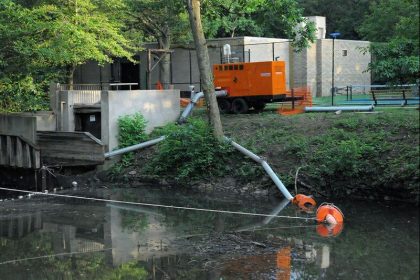 Water pump setup by calm waters.