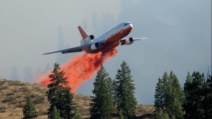 Air tanker dropping fire retardant chemicals
