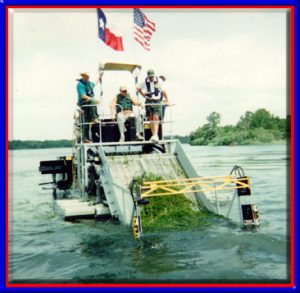 Texas Governor Test Drives TVA's Aquatic Weed Harvester