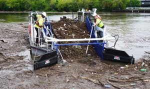Collecting floating debris with an Aquarius Systems Aquatic Debris Skimmer