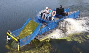 Harvesting aquatic milfoil and algae in Minnesota with HM-420 Harvester