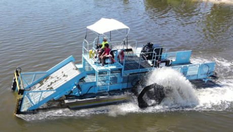 HM-620 in Little Muskego Lake Wisconsin Like an underwater lawnmower, an aquatic weed harvester cuts the vegetation, collecting and storing the weeds on board.