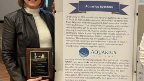 Jane Dauffenbach receiving the Jim Flynn award for Aquarius Systems.